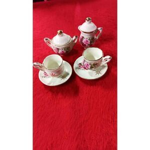 Miniature tea cup and saucer set six pieces vintage